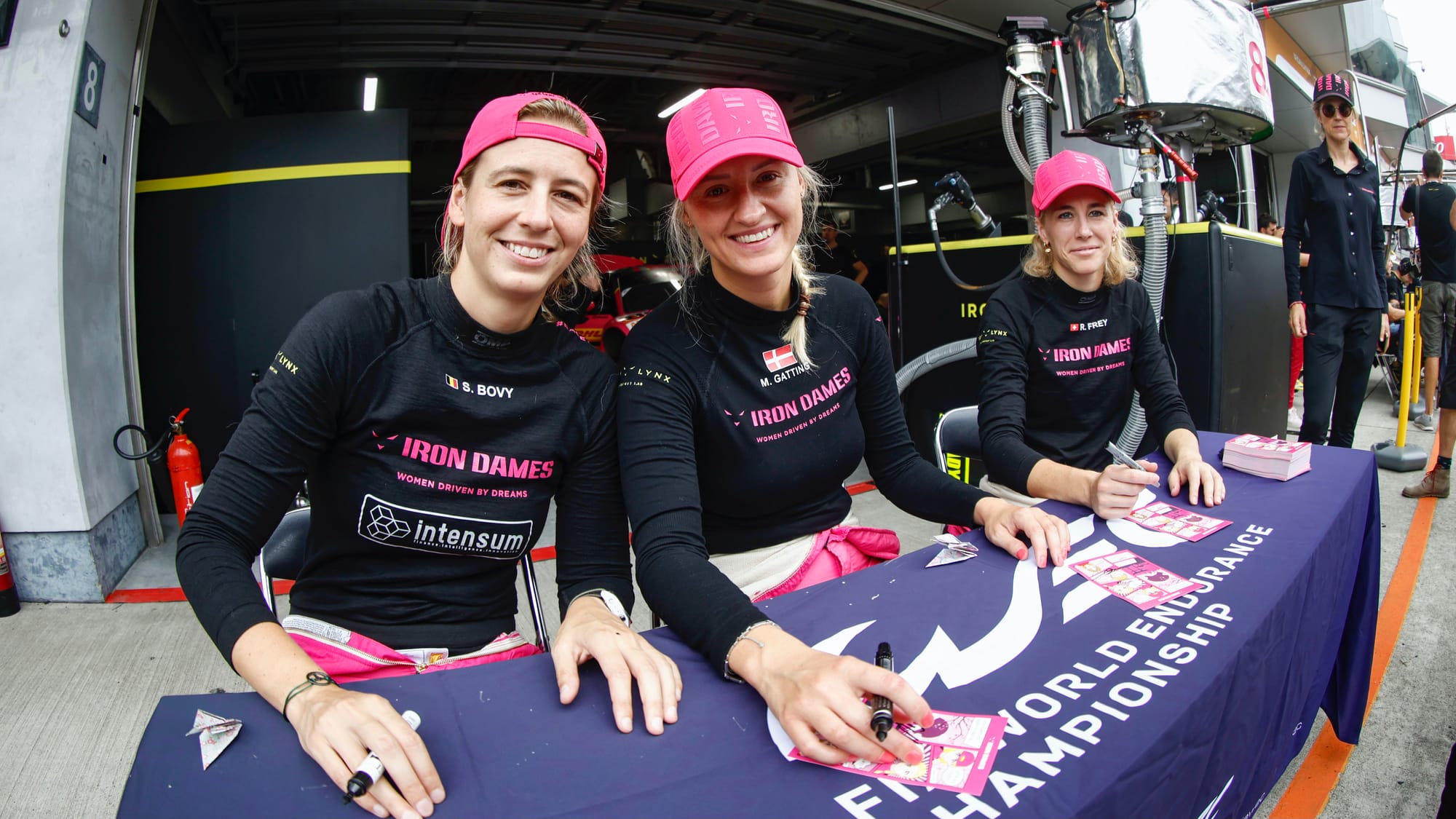 Michelle Gatting, Sarah Bovy and Rahel Frey signing autographs