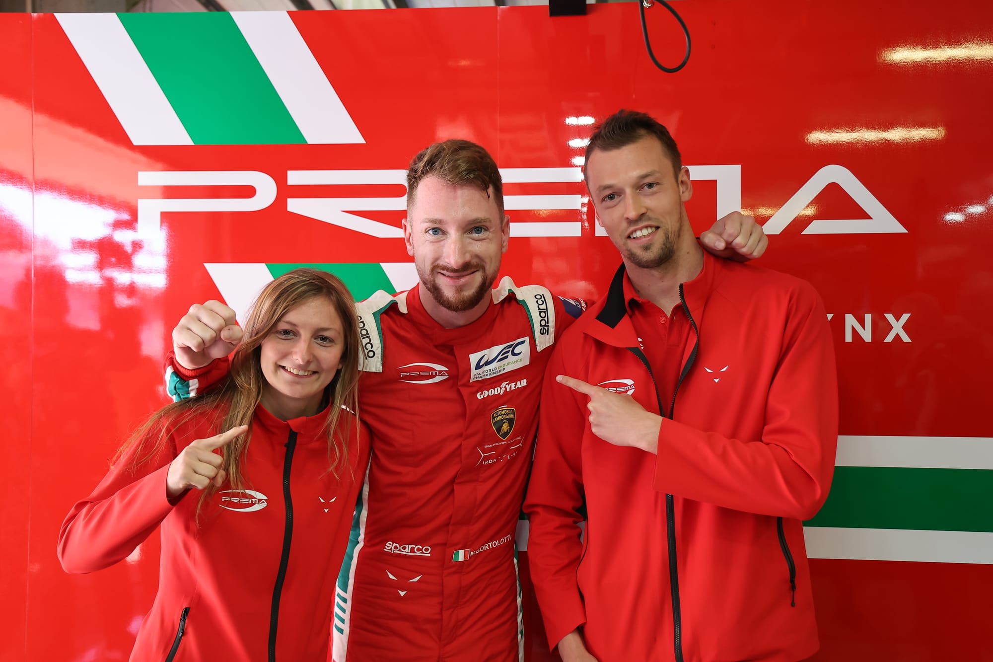 Prema drivers Doriane Pin, Mirko Bortolotti and Daniil Kvyat embrace, Portimao, 2023