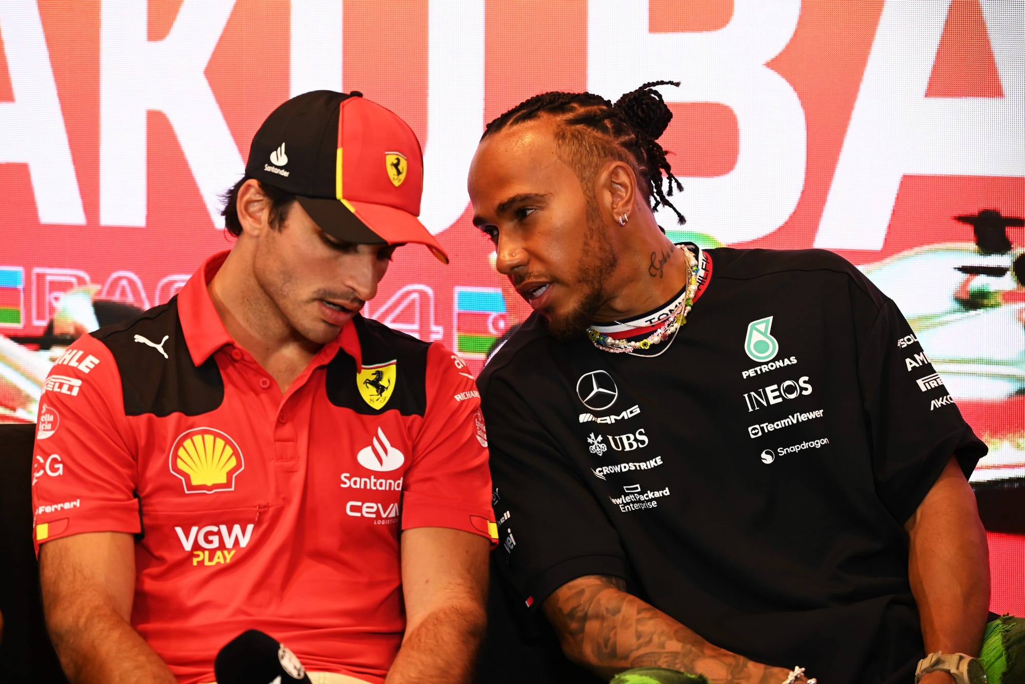 Carlos Sainz, Ferrari, and Lewis Hamilton, Mercedes, F1