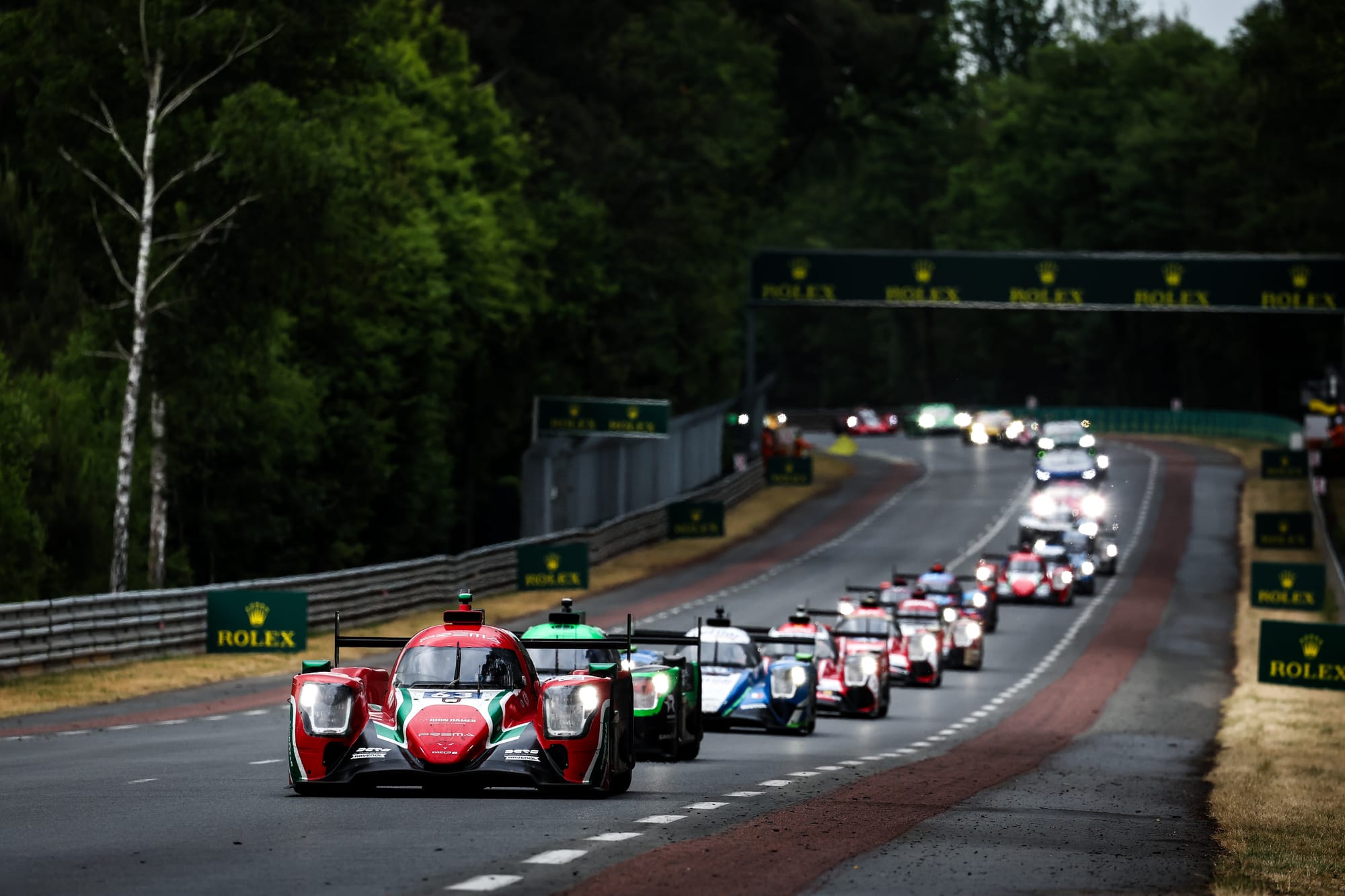Prema's Doriane Pin leads a train of cars at Le Mans 24 Hours, 2023