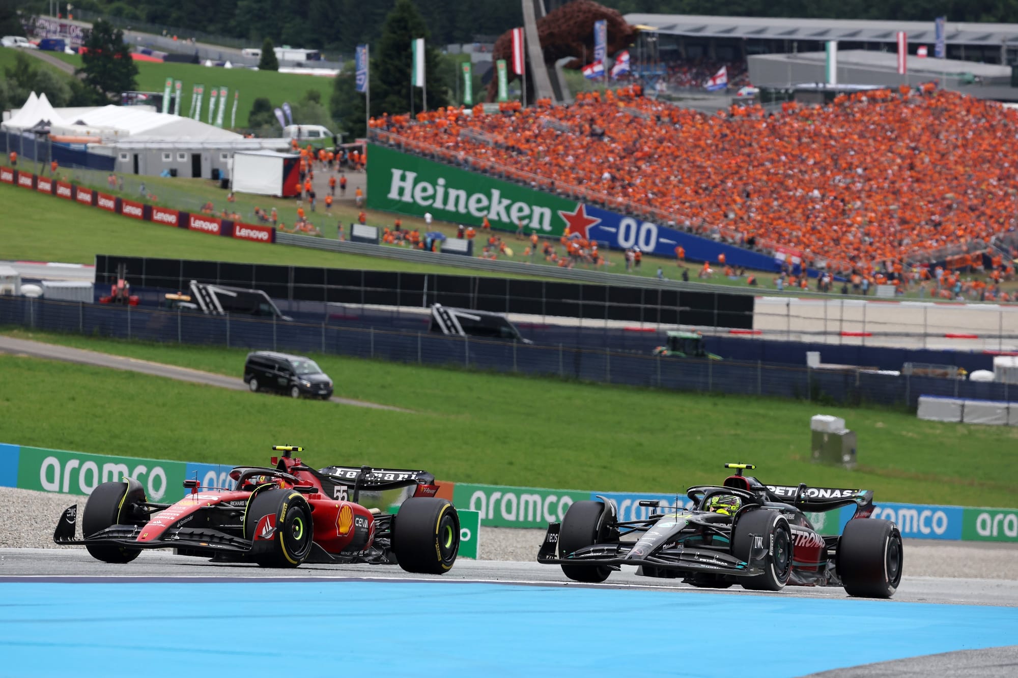 Carlos Sainz, Ferrari, and Lewis Hamilton, Mercedes