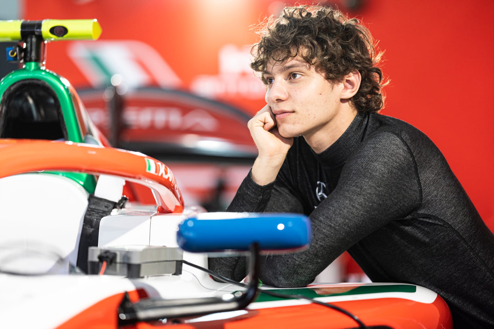 Andrea Kimi Antonelli leans over his Prema Racing Formula 2 car in Bahrain, 2024