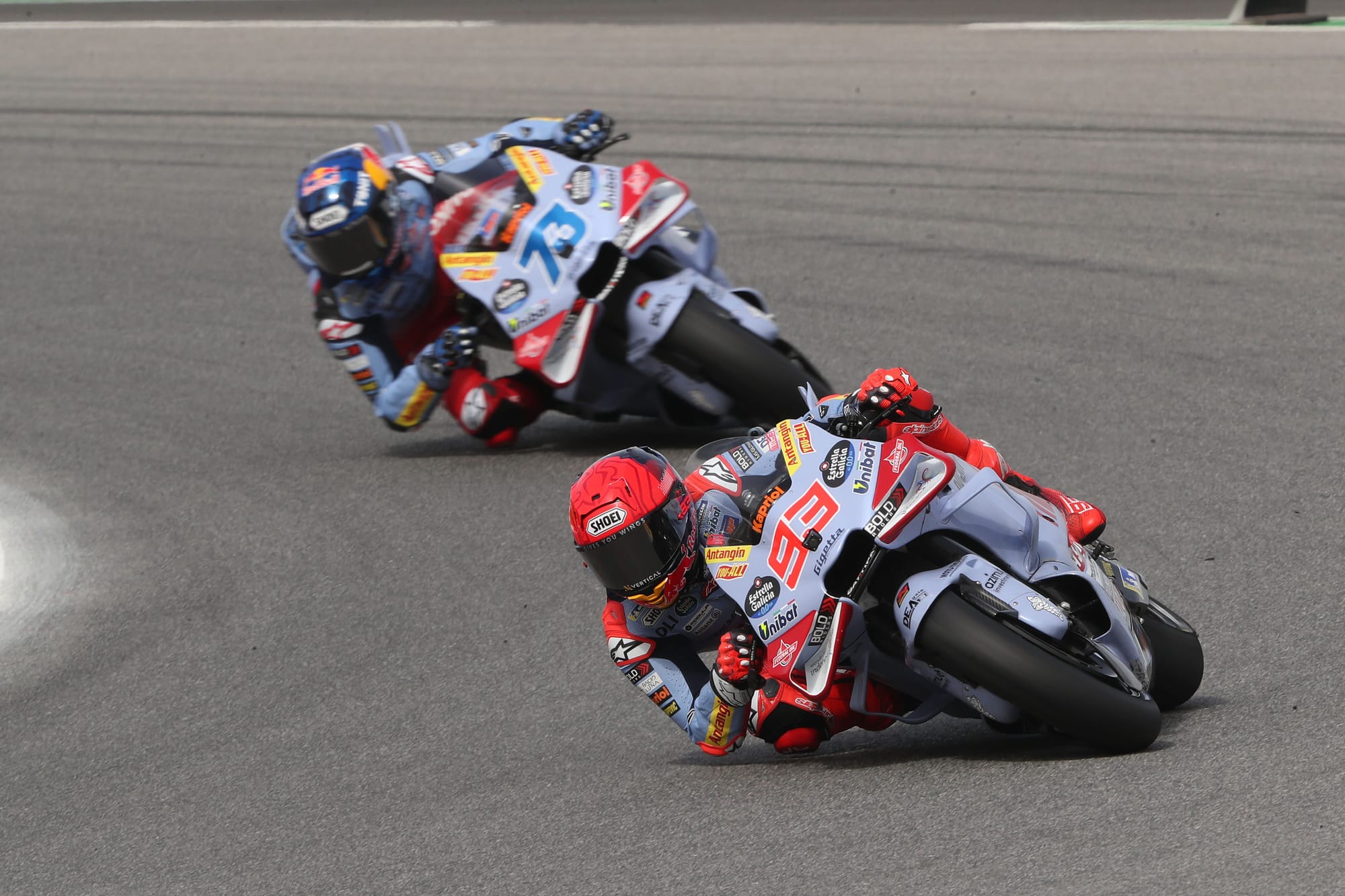 Marc Marquez leads his brother Alex in the Portimao MotoGP sprint race, 2024