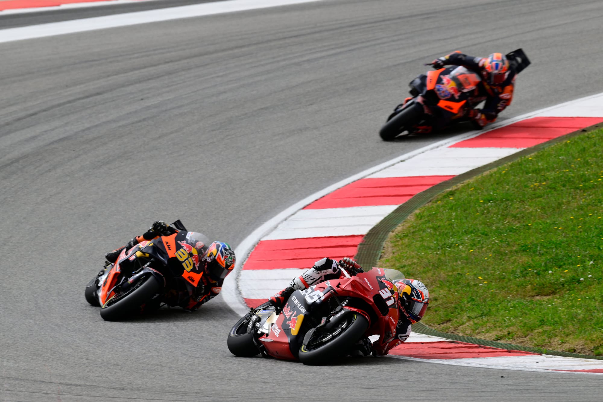 Pedro Acosta leads Brad Binder in the Portimao MotoGP race, 2024