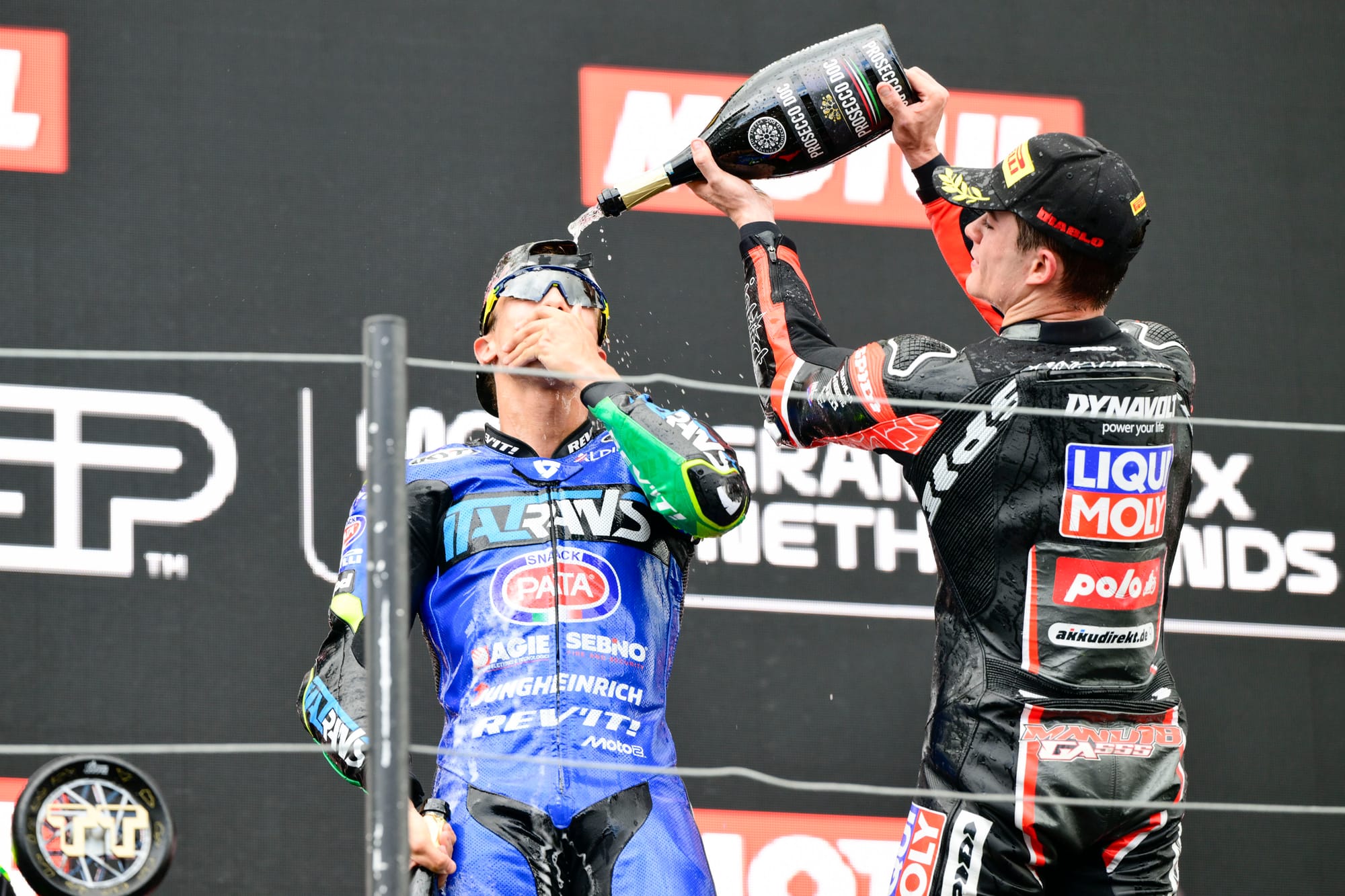 Diogo Moreira and Aron Canet on the Assen Moto2 podium 2025