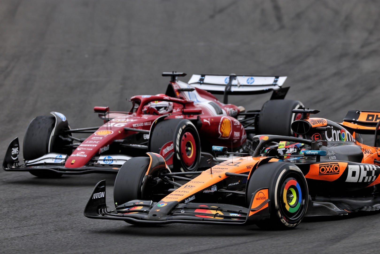 Charles Leclerc, Ferrari, and Oscar Piastri, McLaren, F1
