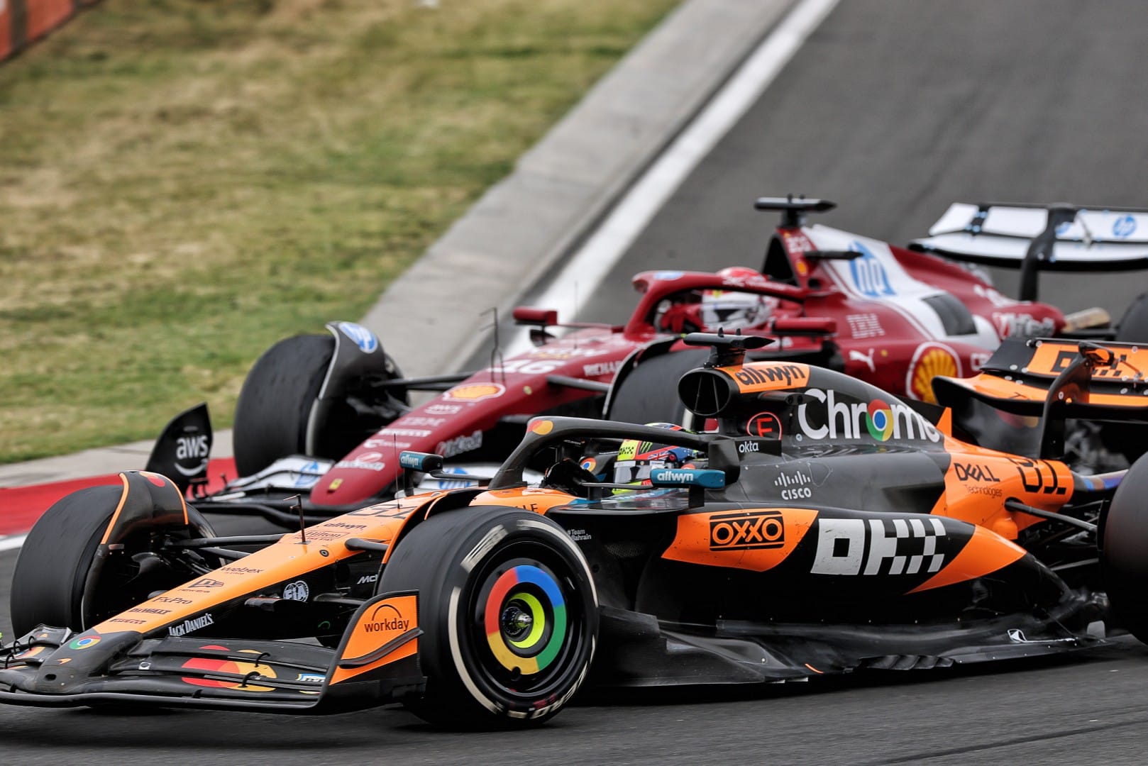 Oscar Piastri, McLaren, and Charles Leclerc, Ferrari, F1