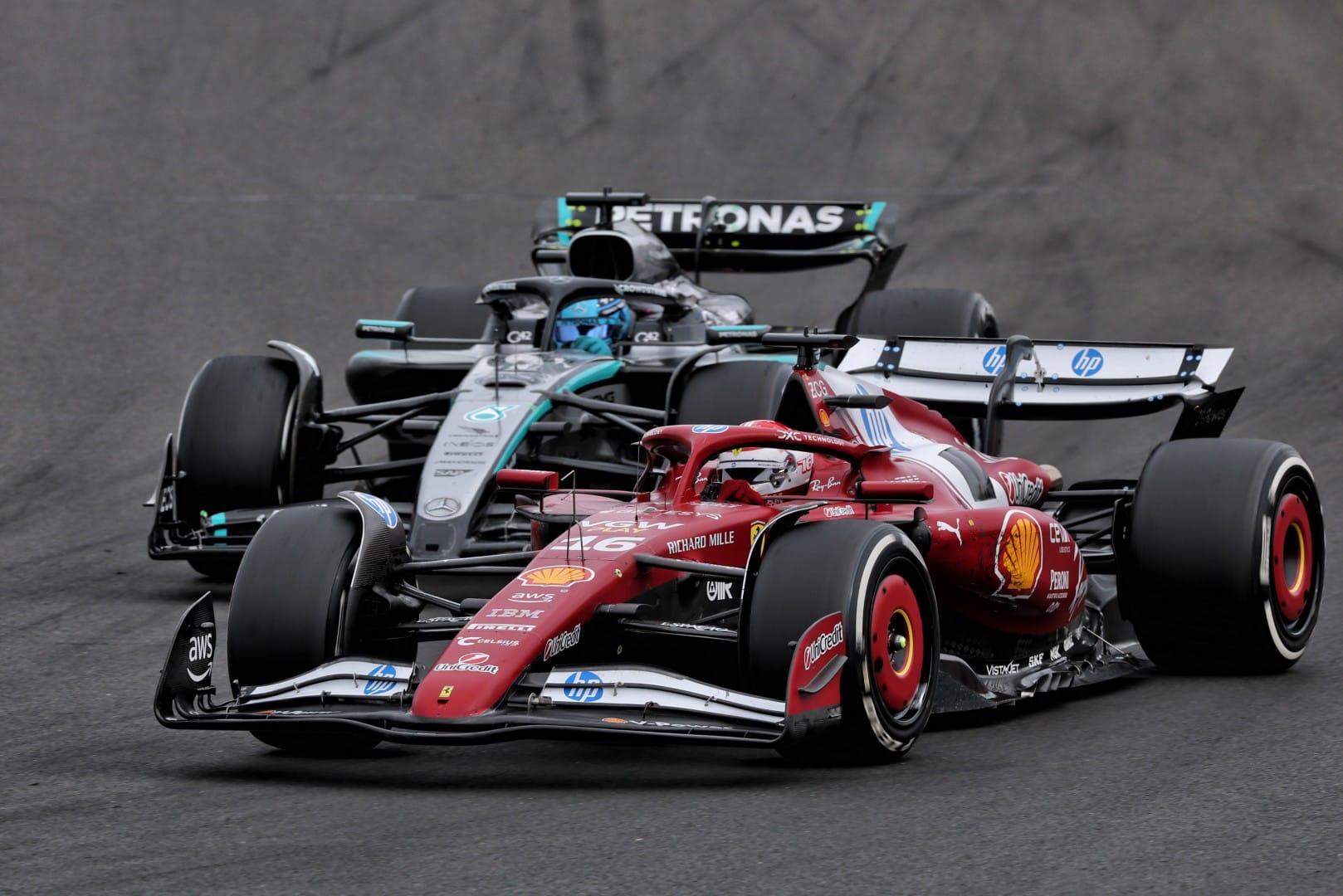 Charles Leclerc, Ferrari, and George Russell, Mercedes, F1