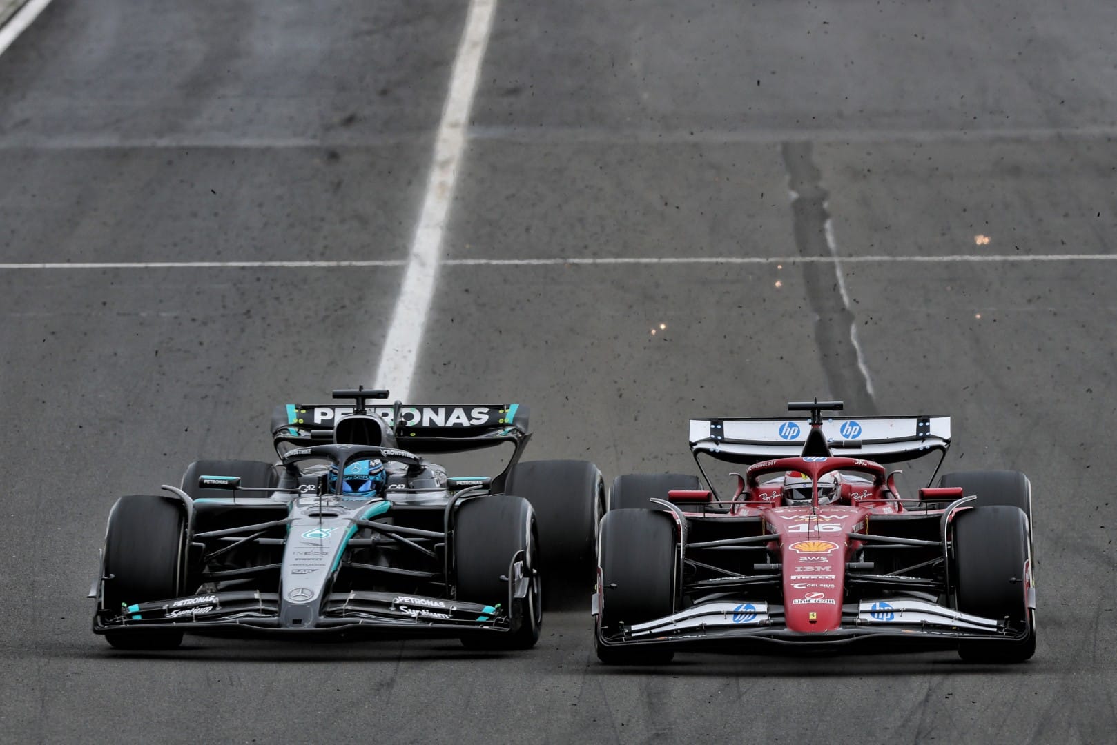 George Russell, Mercedes, and Charles Leclerc, Ferrari, F1