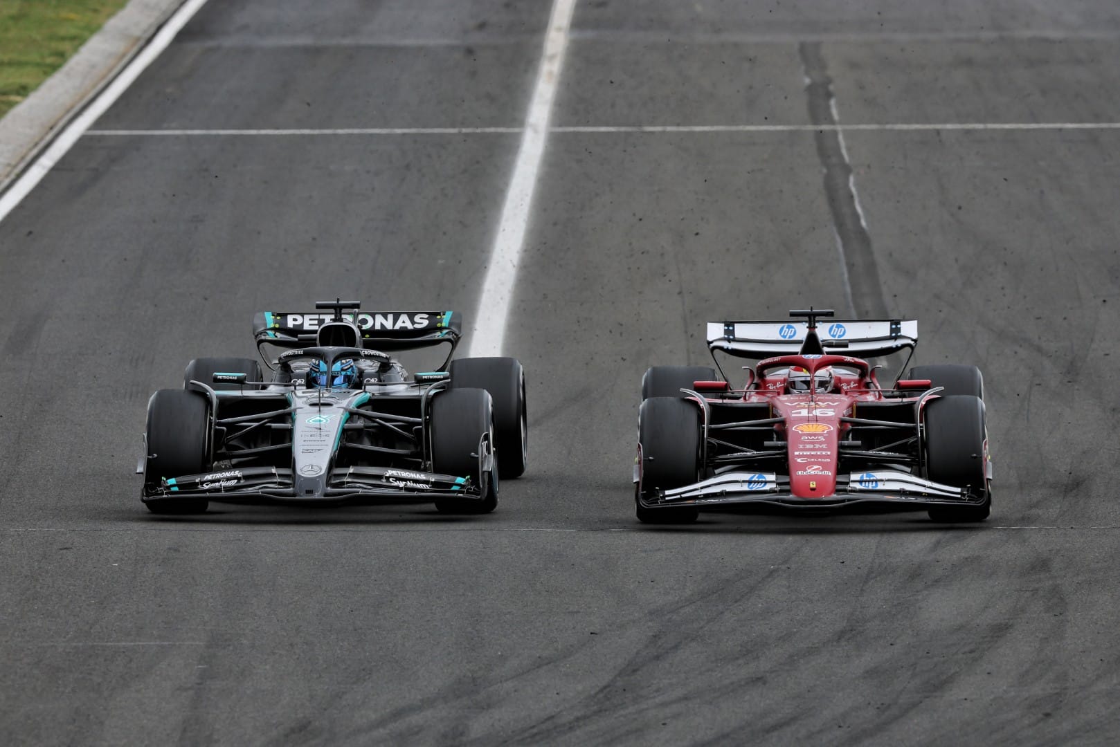 George Russell, Mercedes, F1, and Charles Leclerc, Ferrari, F1